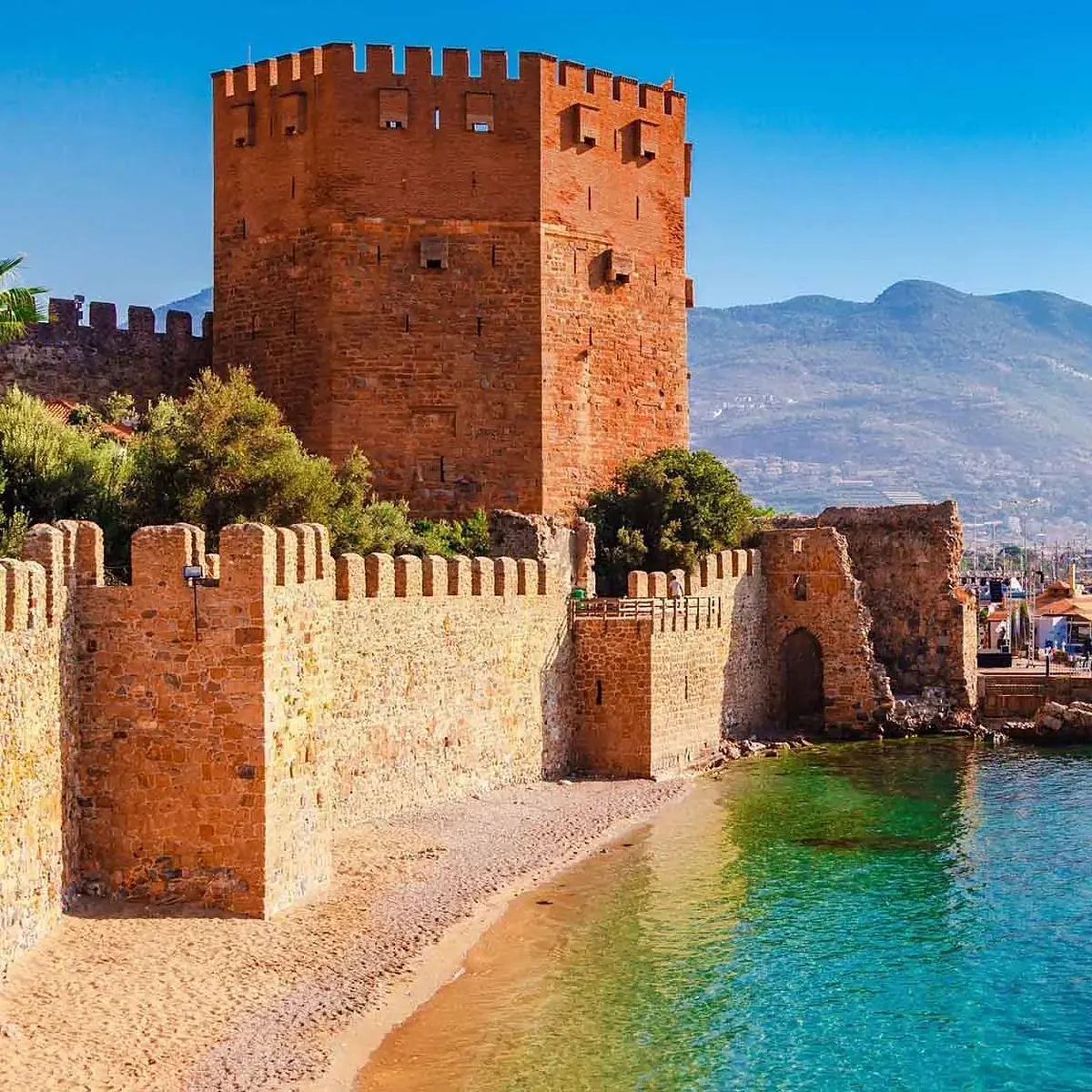 The Red Tower and castle walls on the Alanya harbour
